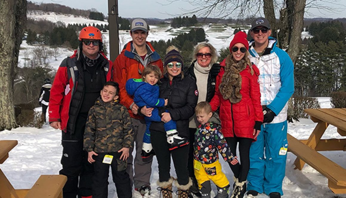 Exley Family photo outside ski lodge