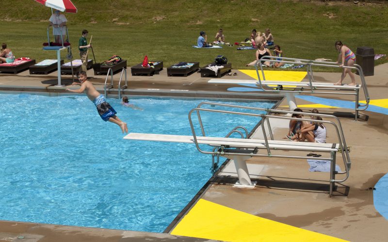 Child jumping off diving board